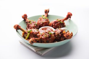 114795605 szechuan chicken which is a popular indo chinese non vegetarian recipe served in a plate with chilli 300x200 1